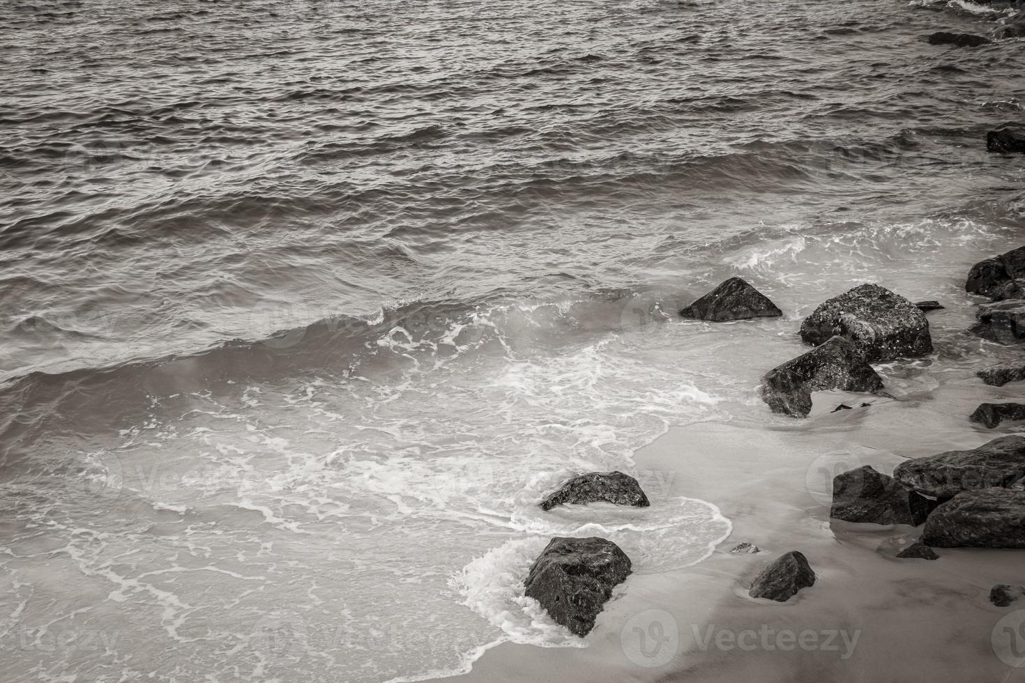 Flamengo Beach boulders blue water waves Rio de Janeiro Brazil. photo