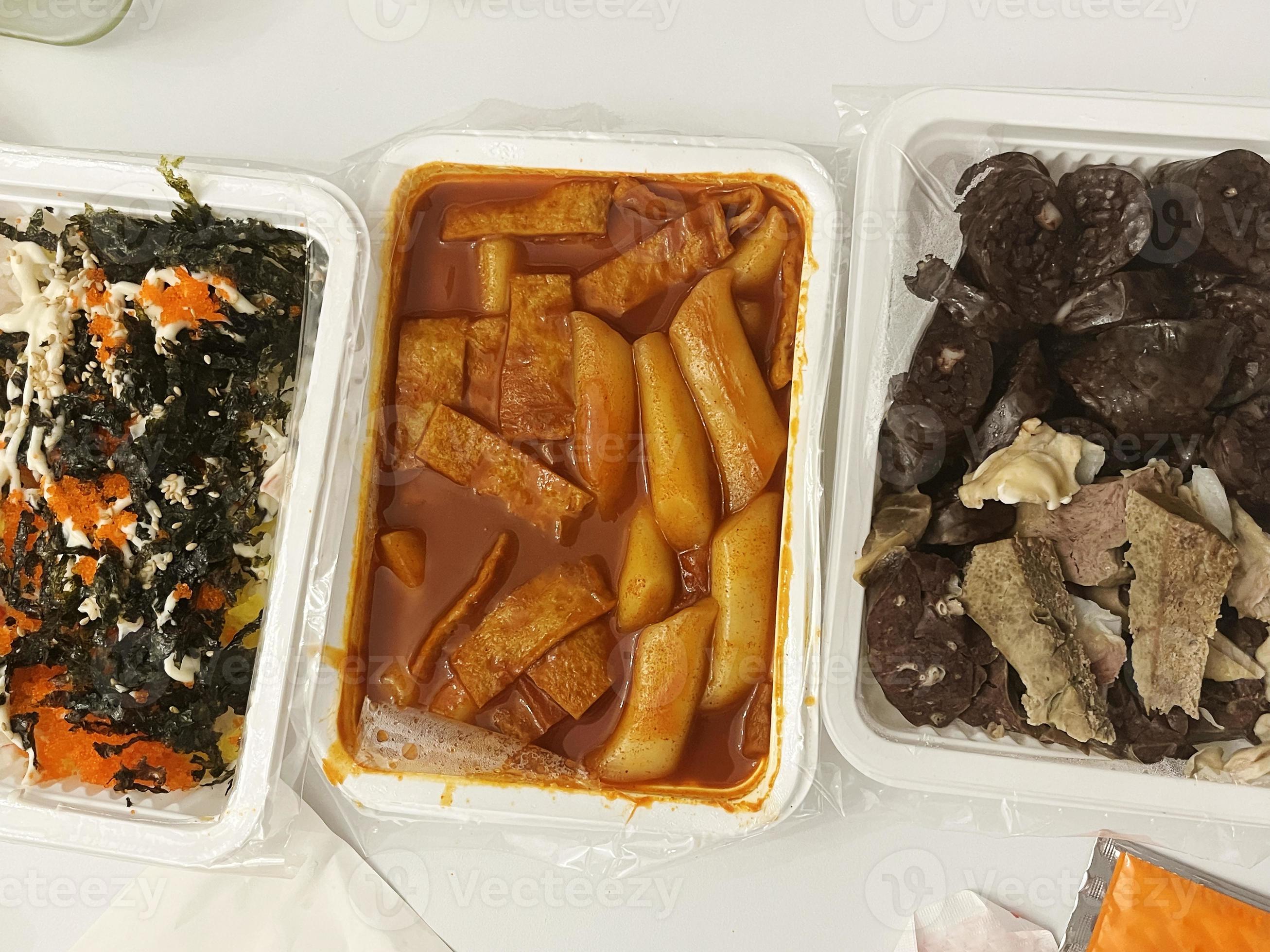 A set menu of Korean street food with Tteokbokki, Sundae, and Jumeok