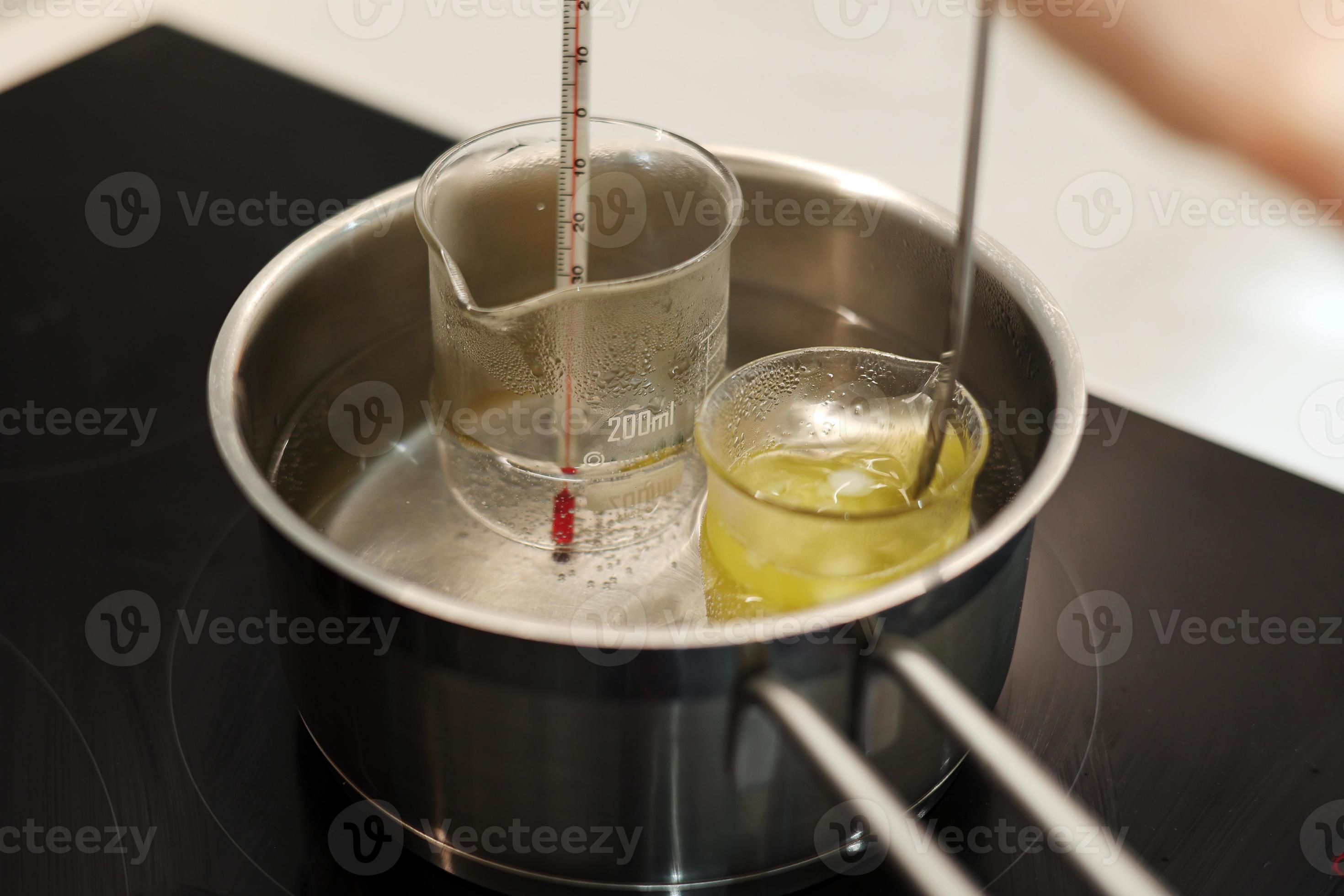 Heat beakers of water and jojoba oil in boiling water, record the