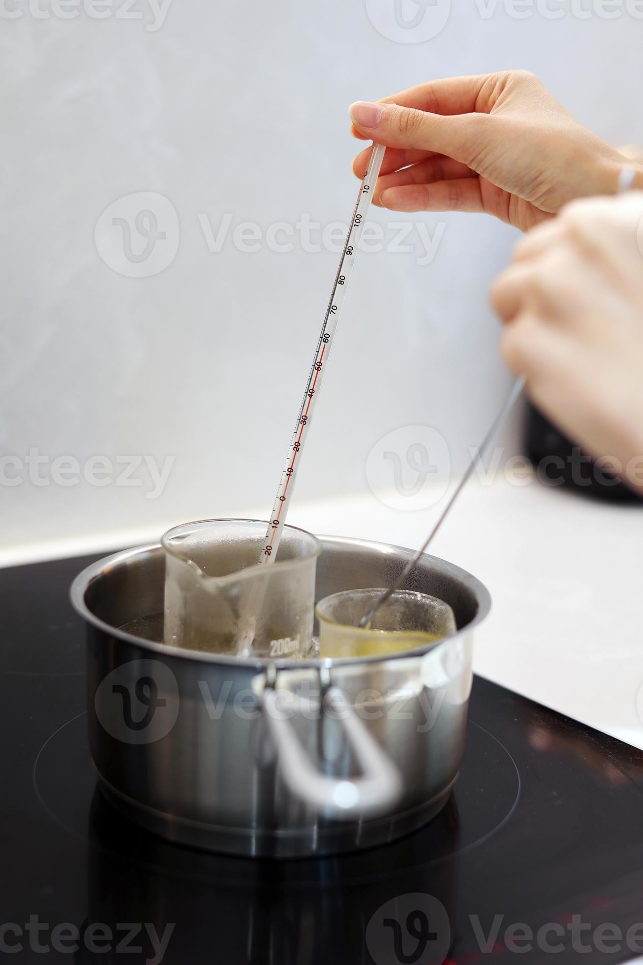 Heat beakers of water and jojoba oil in boiling water, record the