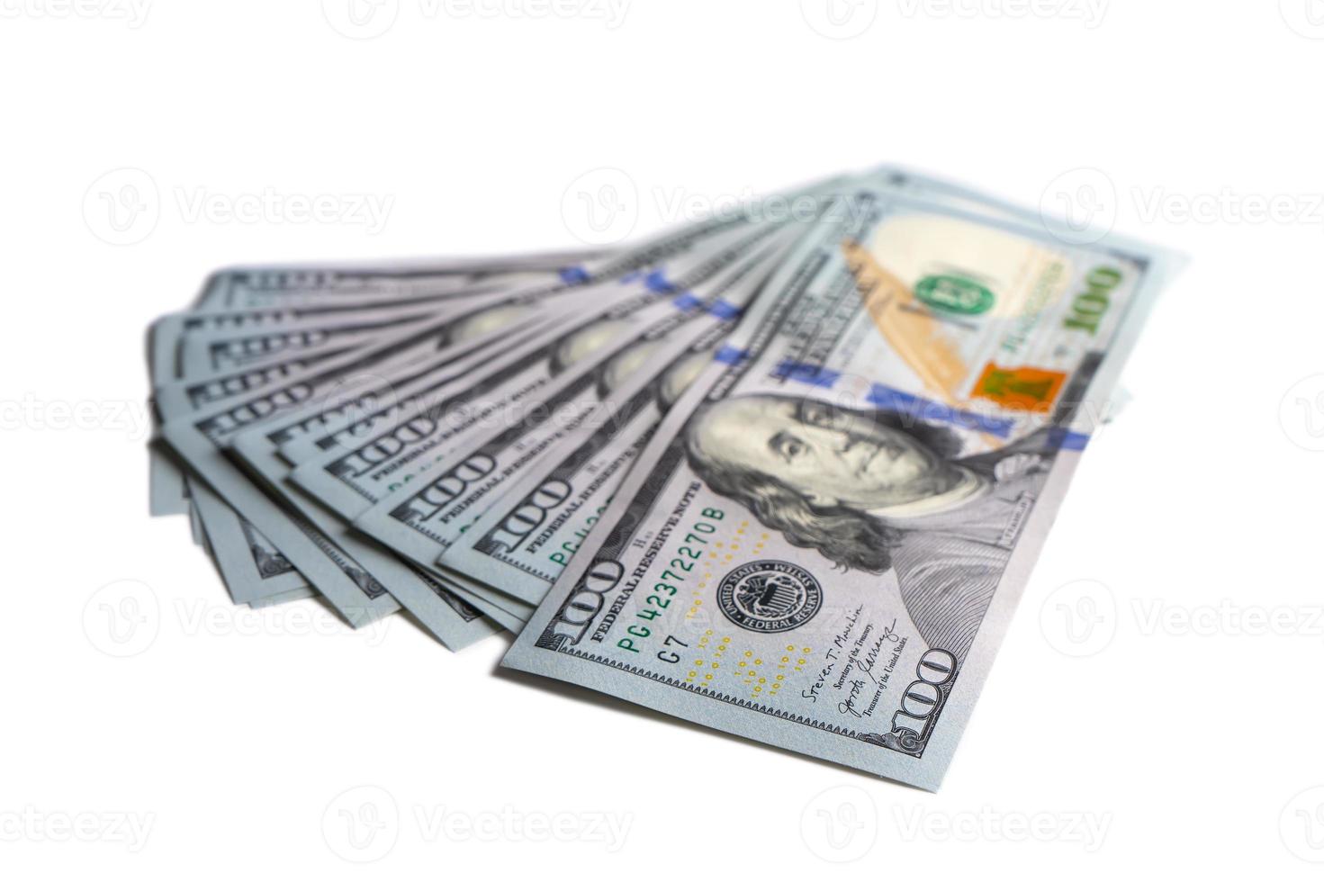 Pile of new design US dollar bills on white background photo