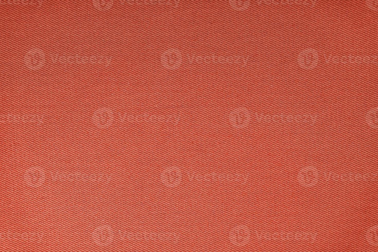Texture of red fabric diagonal weave pattern. Decorative textile background photo