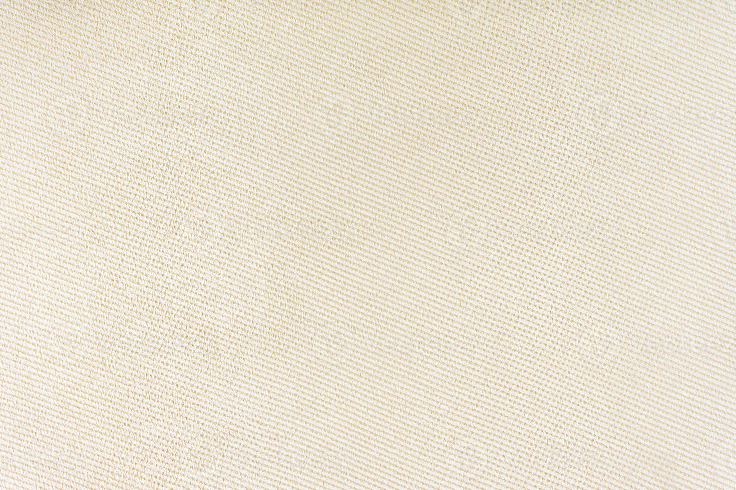 Texture of beige fabric diagonal weave pattern. Decorative textile background photo