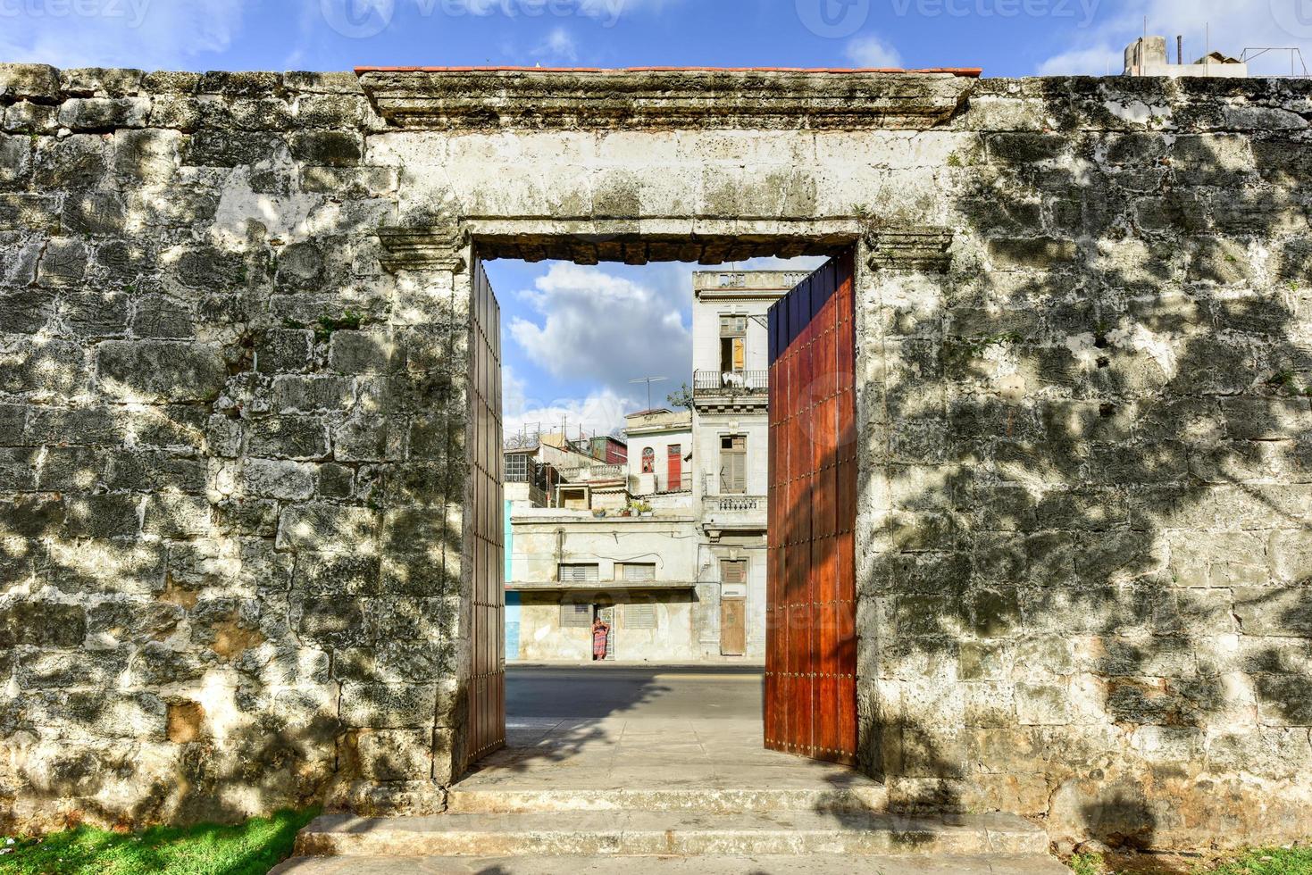 Remains of the old city wall la Muralla and entrance built during Spanish colonial times in Havana Cuba photo