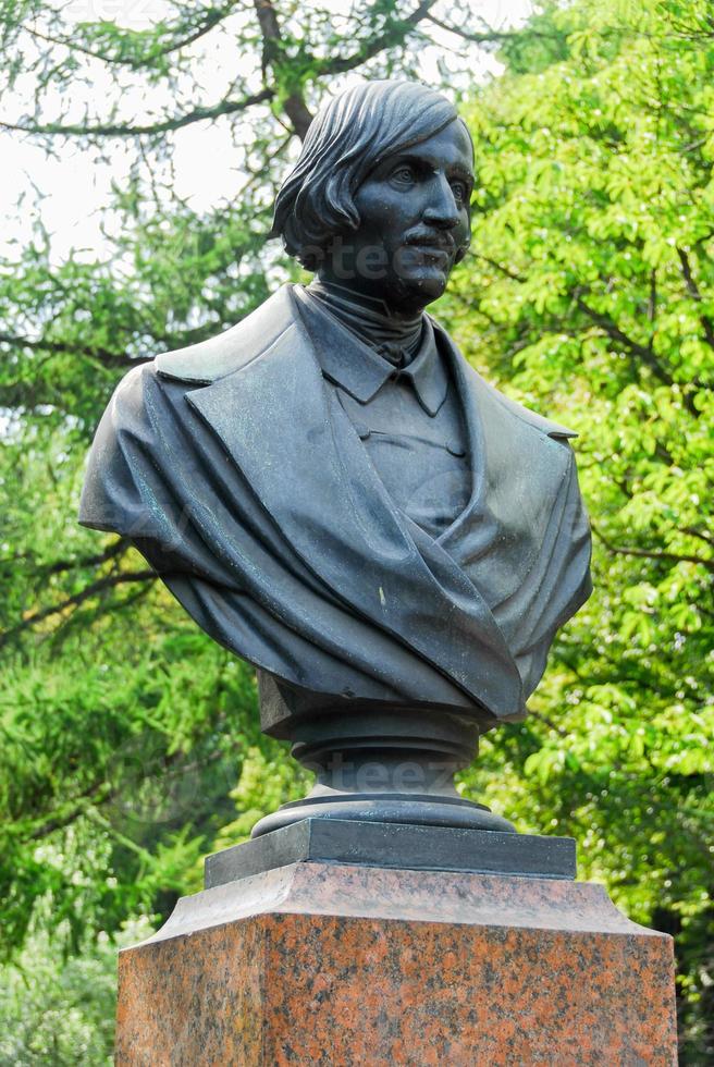 Monument to Nikolai Vasilievich Gogol Ukrainian  Russian dramatist novelist in front of the Admiralty building in Saint Petersburg Russia photo