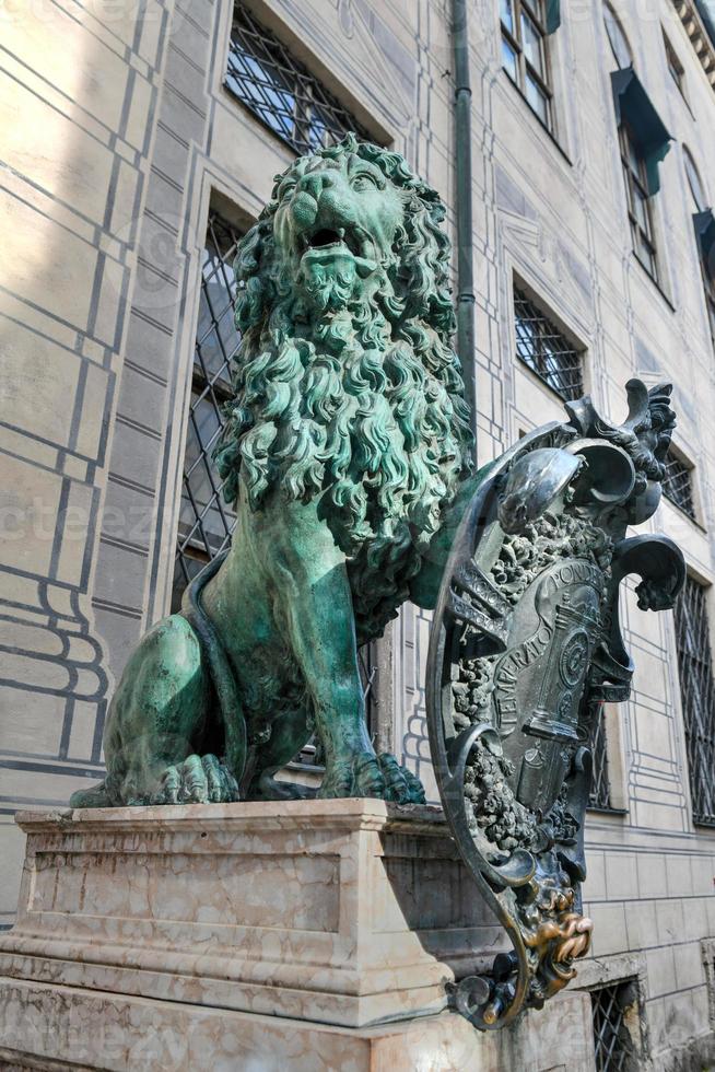 Munich Germany  July 5 2021   Lion statue in front of the Alte residenz at Odeonsplatz  Munich Bavaria Germany photo