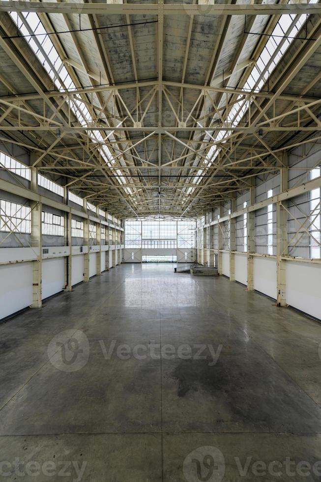 Newly constructed empty warehouse factory from above photo