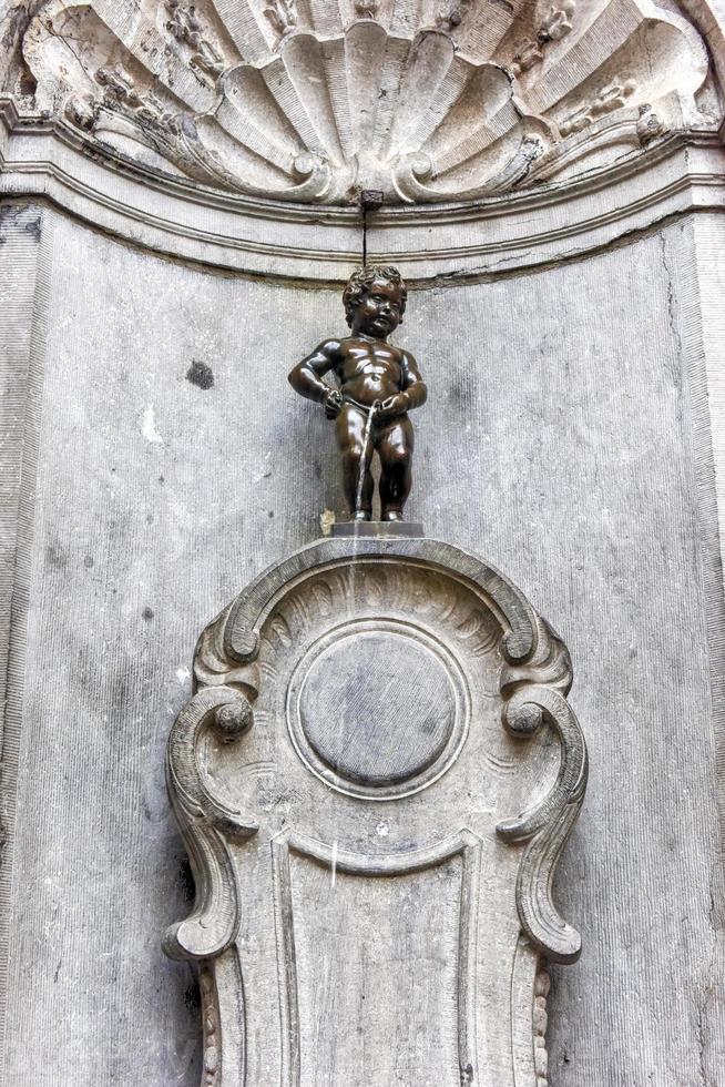 Famous statue Manneken Pis Little man Pee in Brussels Belgium photo