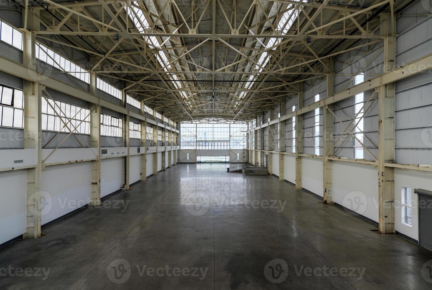 Newly constructed empty warehouse factory from above photo