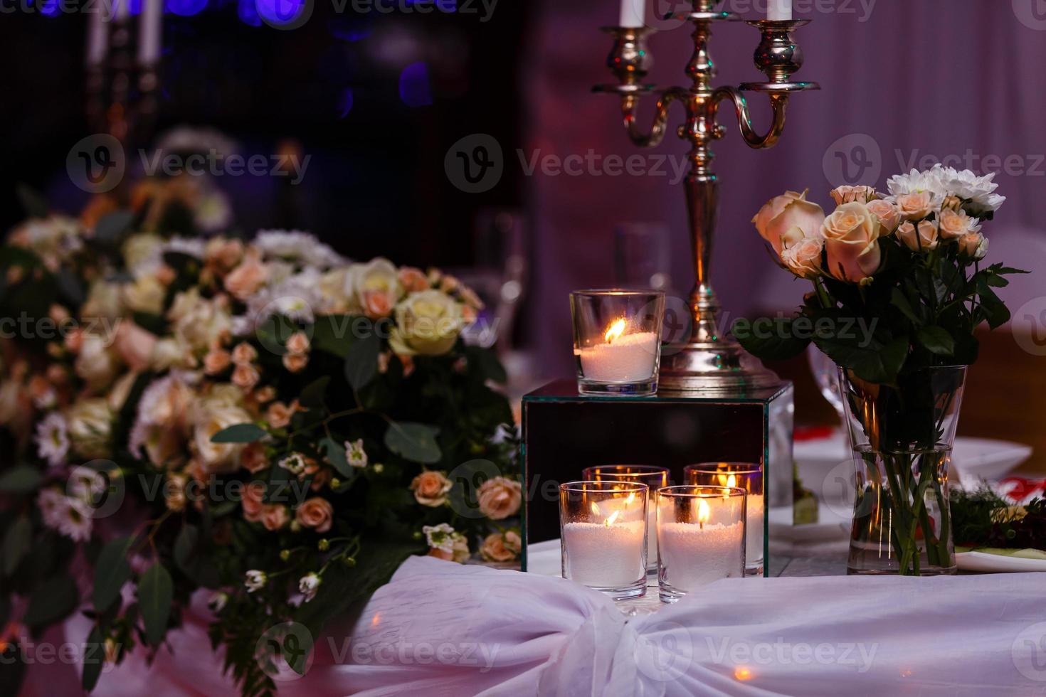 Main table at a wedding reception lit with fairy lights photo