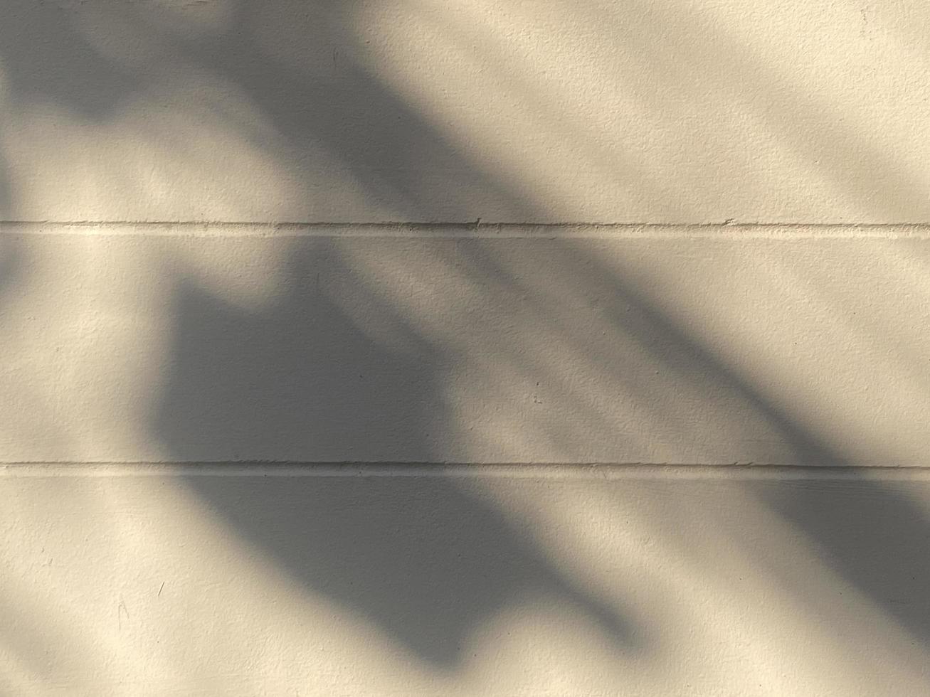 Shadow light on concrete wall background photo