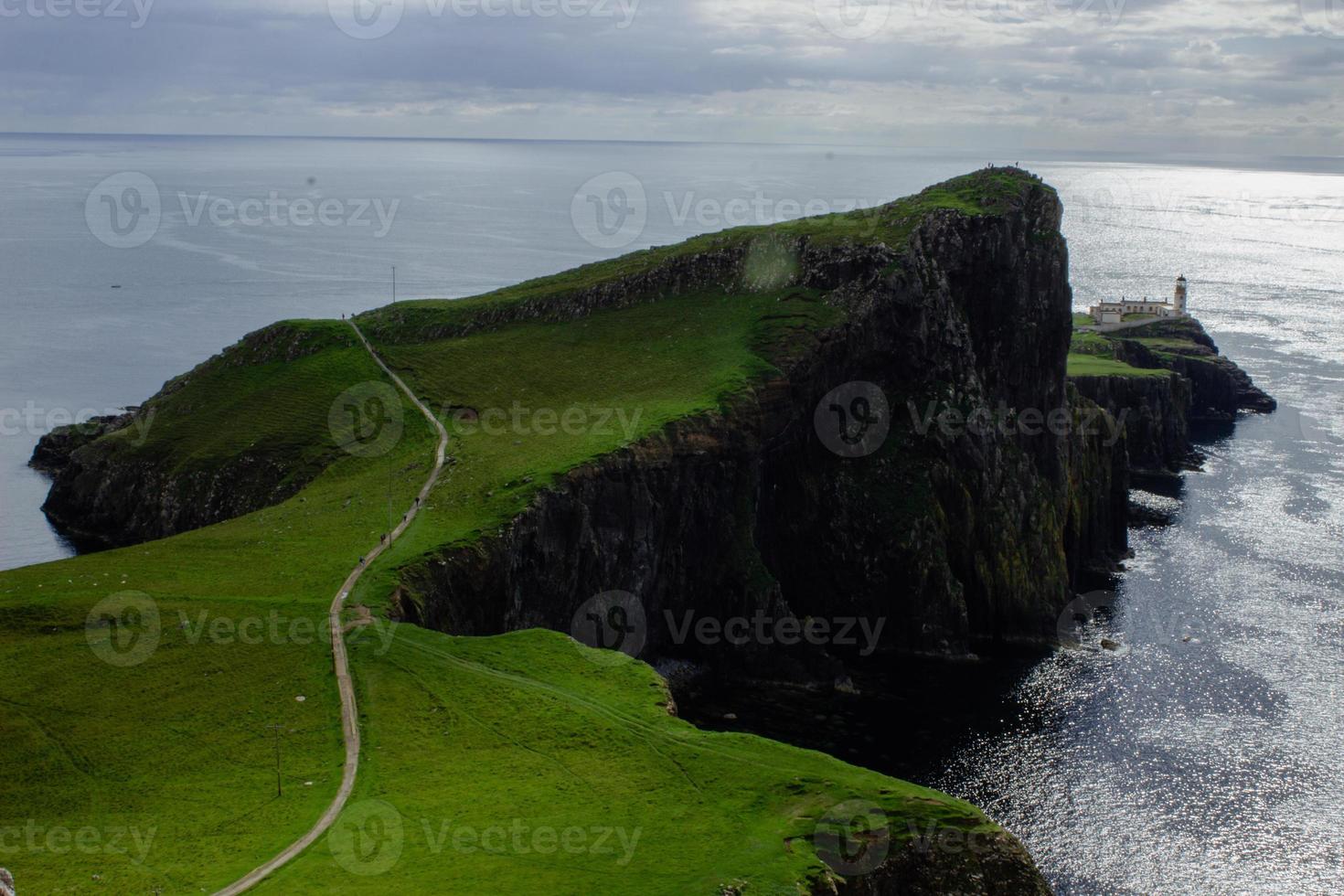 ocean coast at Neist point lighthouse, Scotland photo