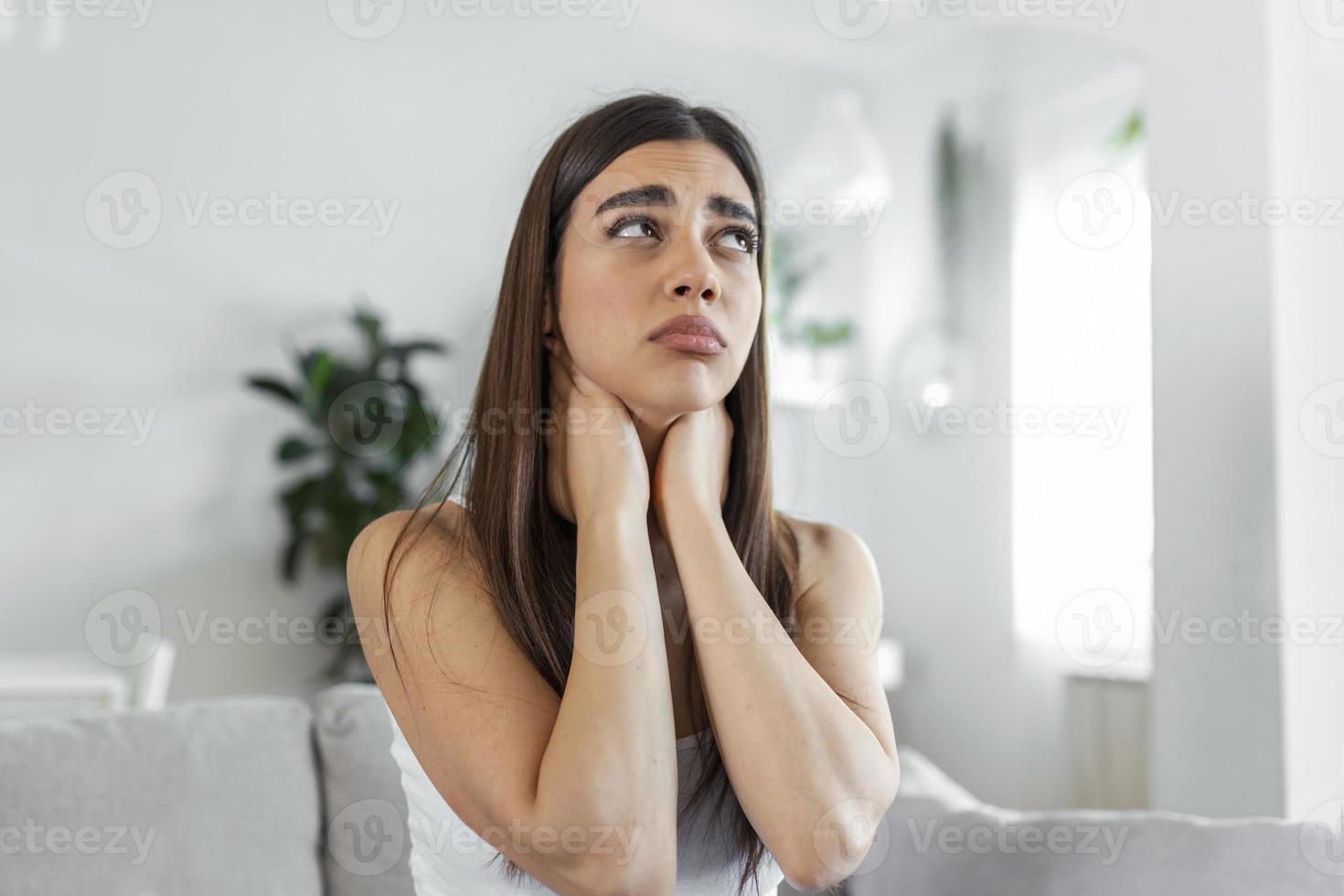Tired woman massaging stiff sore neck, tensed muscles fatigued from computer work in incorrect posture while feeling hurt joint shoulder back pain ache. Fibromyalgia concept photo