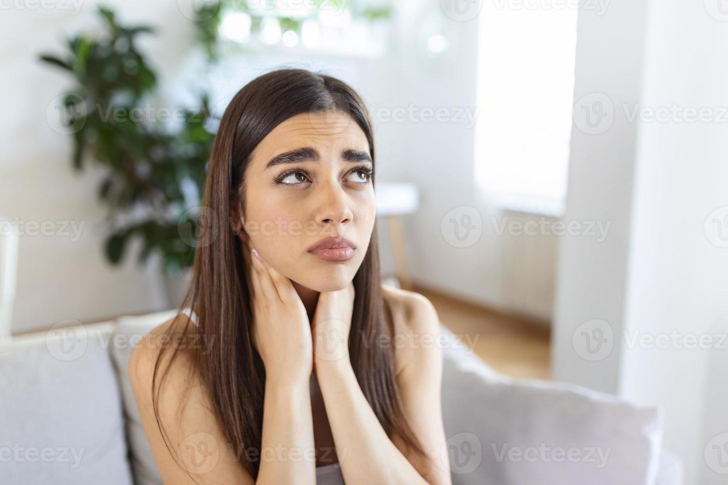 Tired woman massaging stiff sore neck, tensed muscles fatigued from computer work in incorrect posture while feeling hurt joint shoulder back pain ache. Fibromyalgia concept photo