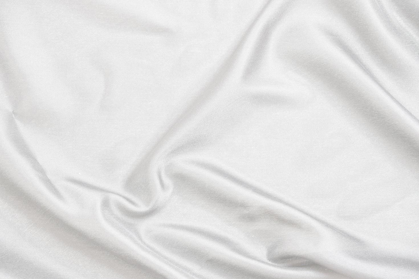 Smooth elegant white silk fabric or satin luxury cloth texture for abstract background photo