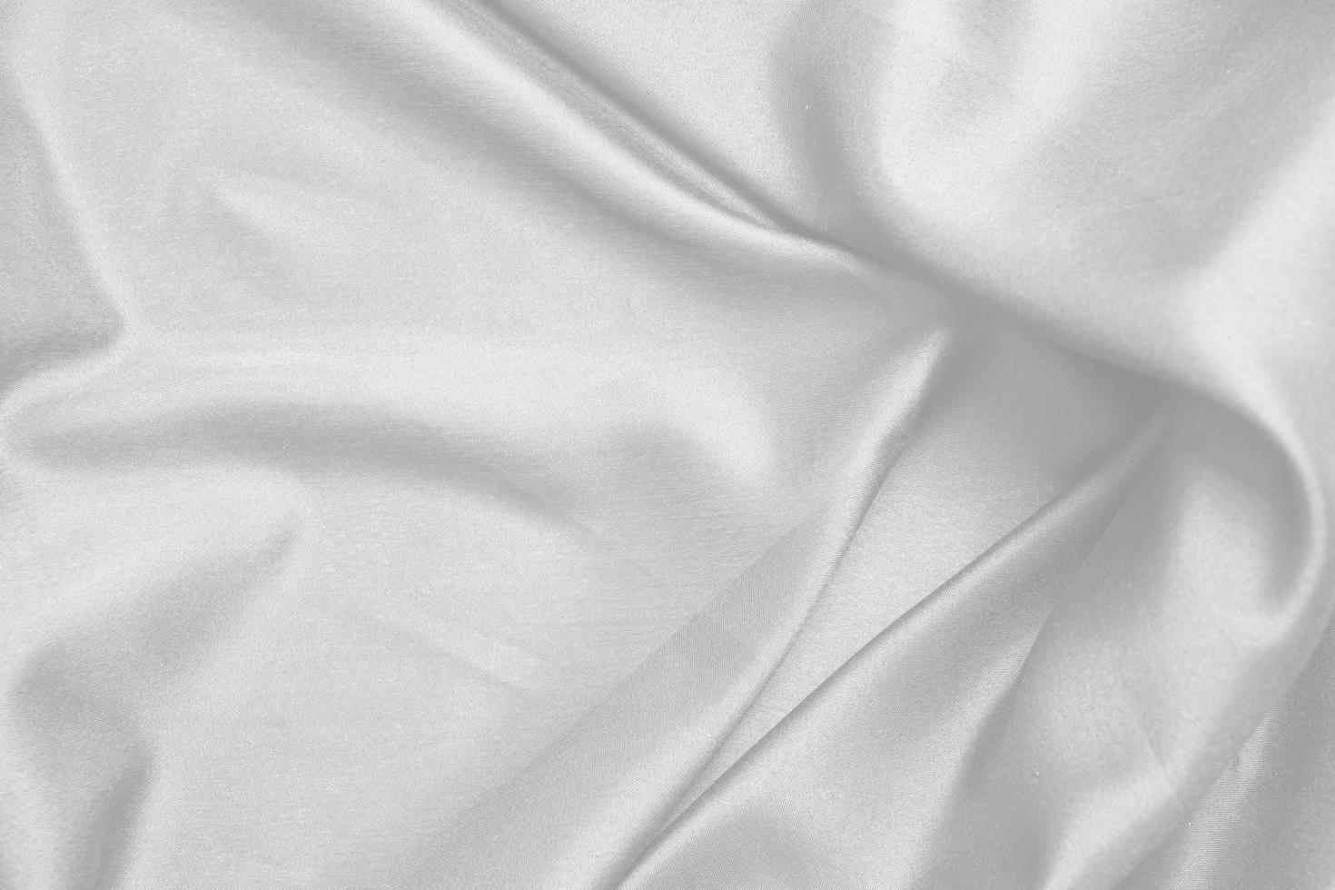 Smooth elegant white silk fabric or satin luxury cloth texture for abstract background photo
