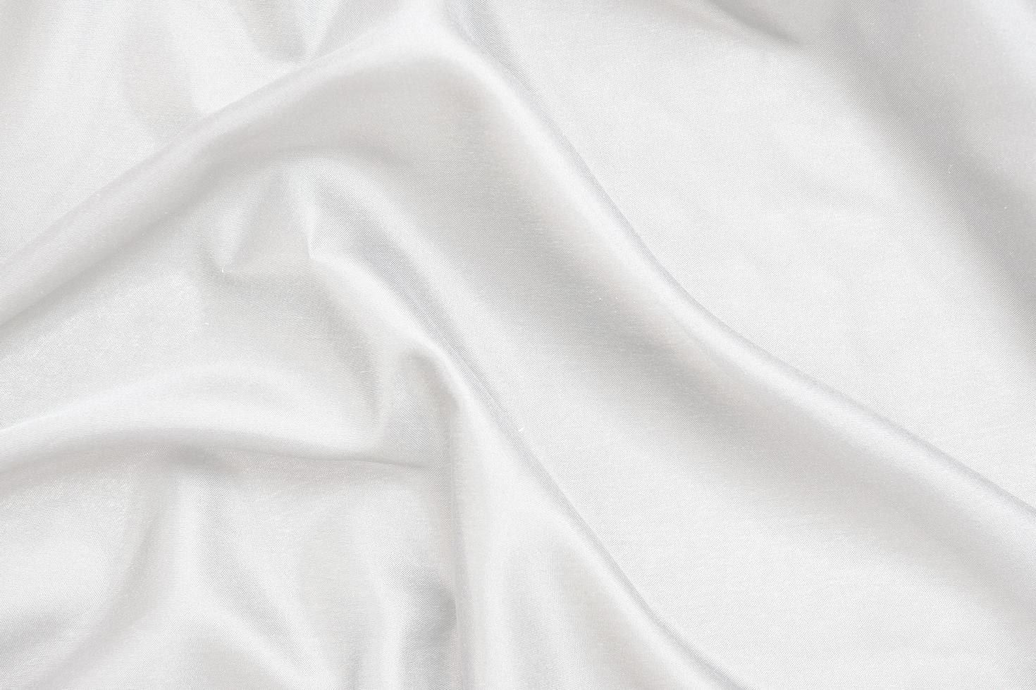Smooth elegant white silk fabric or satin luxury cloth texture for abstract background photo