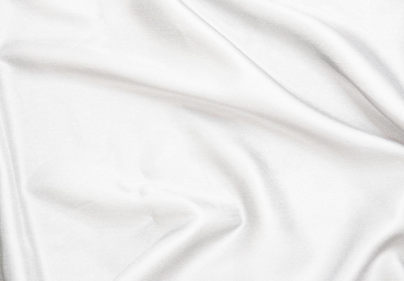 Smooth elegant white silk fabric or satin luxury cloth texture for abstract background photo