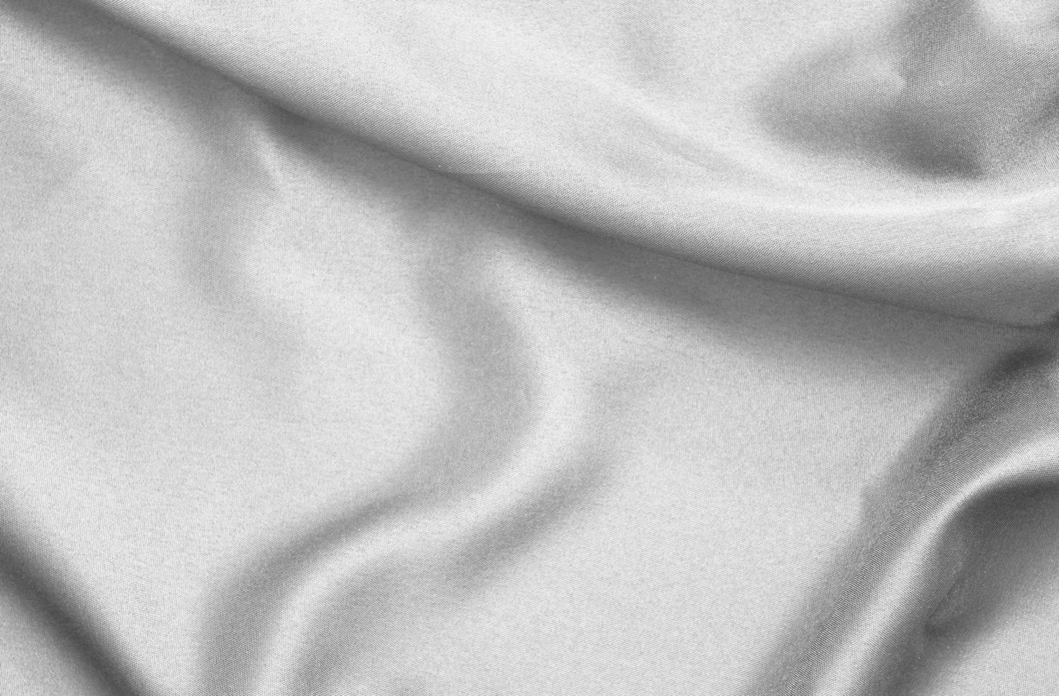 Smooth elegant black silk fabric or satin luxury cloth texture for abstract background photo