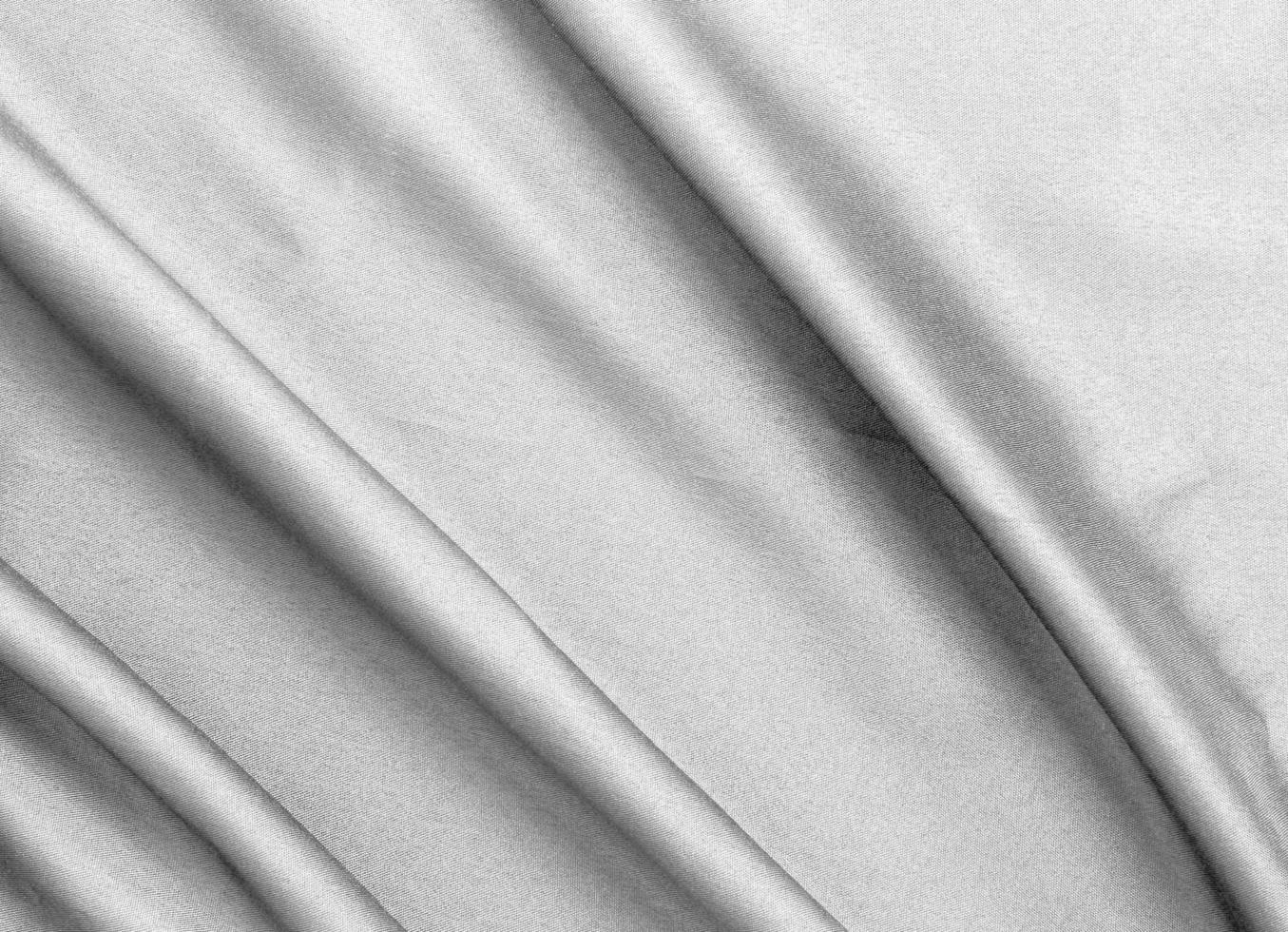 Smooth elegant black silk fabric or satin luxury cloth texture for abstract background photo