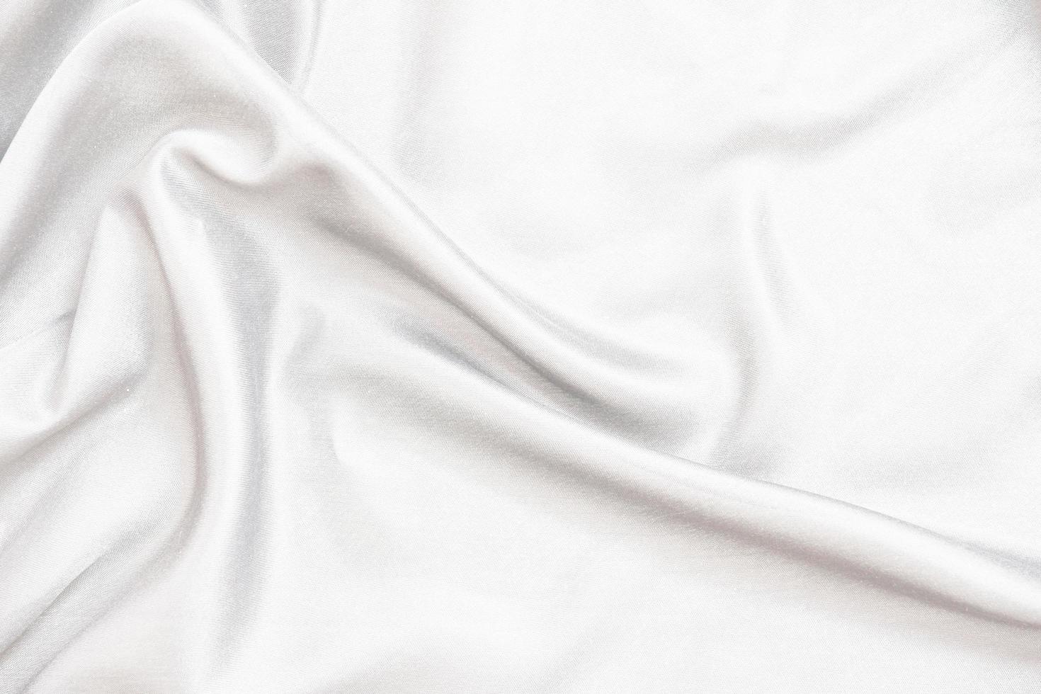 Smooth elegant white silk fabric or satin luxury cloth texture for abstract background photo