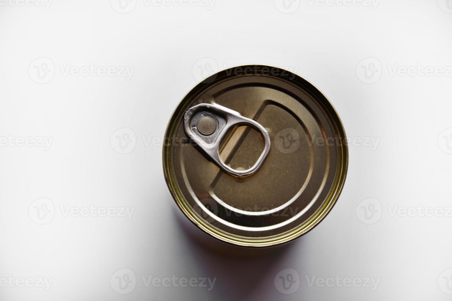 The lid of a tin can on a white background. A tin can. photo