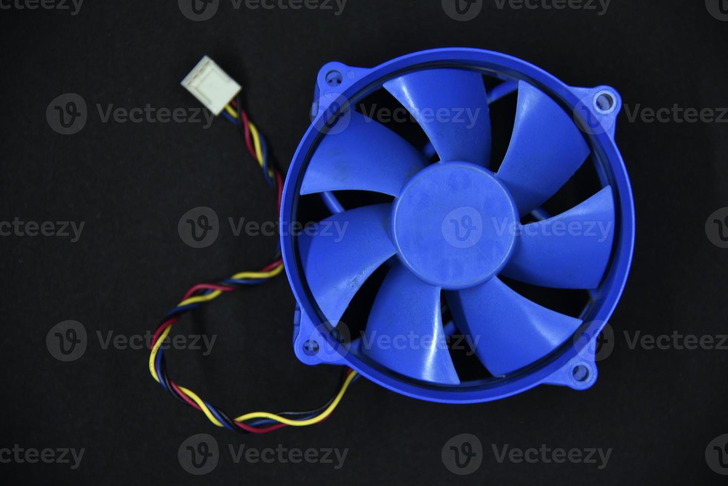 Blue electric fan for cooling the computer processor. Computer fan. photo