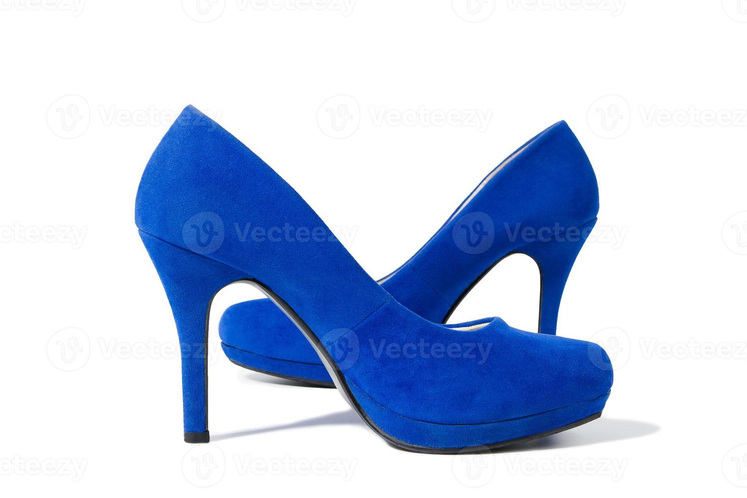 Shoes fashion woman closeup. Close-up high heels pair women shoes isolated on white background. Elegant luxury female Blue footwear on floor. Stylish suede shue. Selective focus. photo