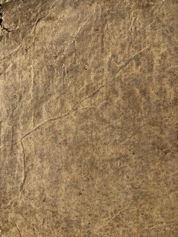 Old paper with stains and folds. Grunge paper texture for background photo