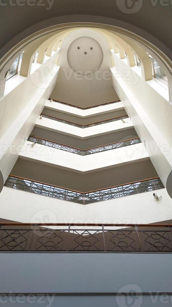 Interior view of atrium hall or foyer between modern between floor. photo