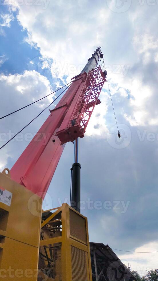 Mobile crane telescope boom erection or soaring to the sky. photo