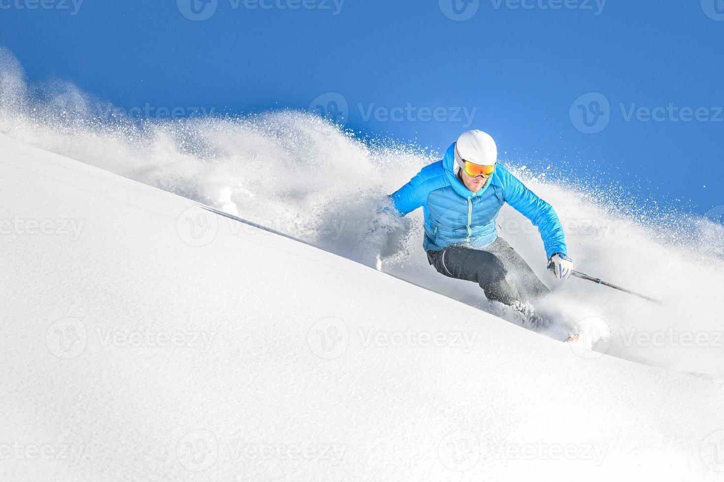 A skier in powder off-piste photo