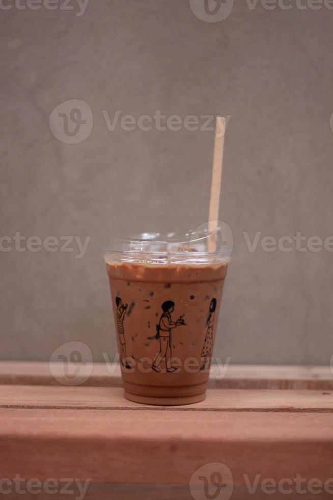 Iced mocha on wooden table photo