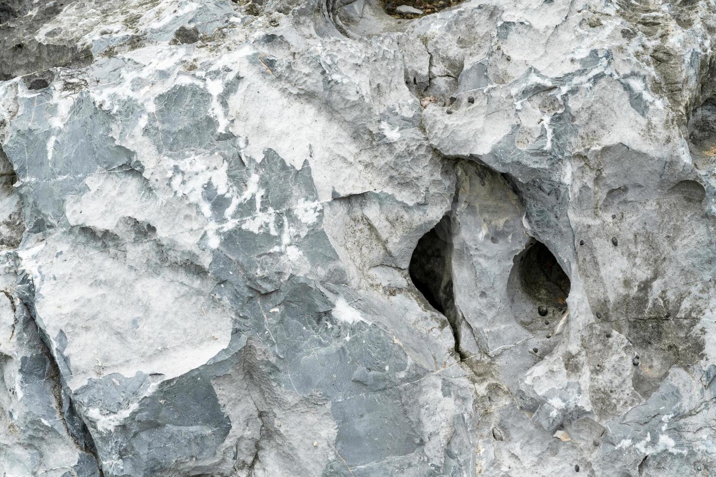 Closeup rock pattern with hole in nature photo