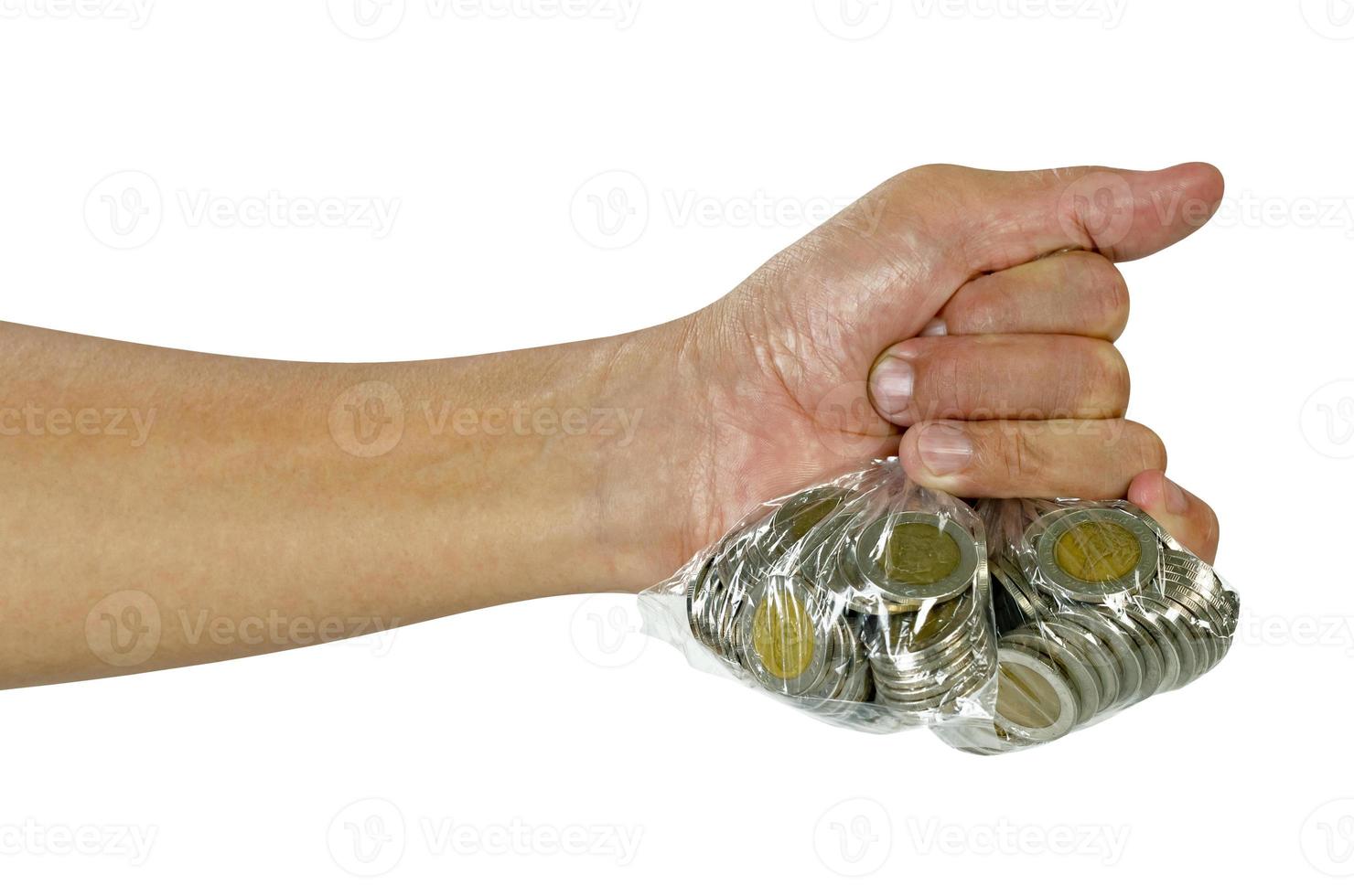 Hand holding coins in plastic bag isolated on white background,include clipping path photo