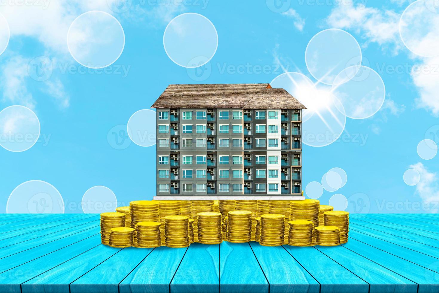 Start creating family with top table condominium and coin on white cloud and blue sky background,Dream family concepts photo