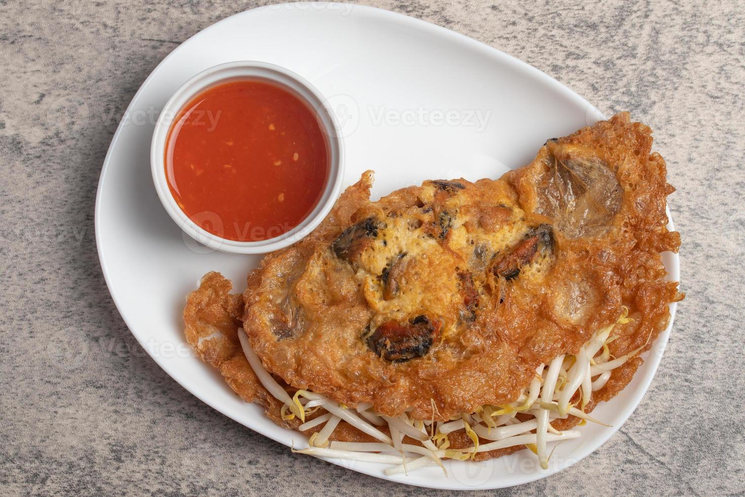 Fried mussels in crispy batter in a white plate photo