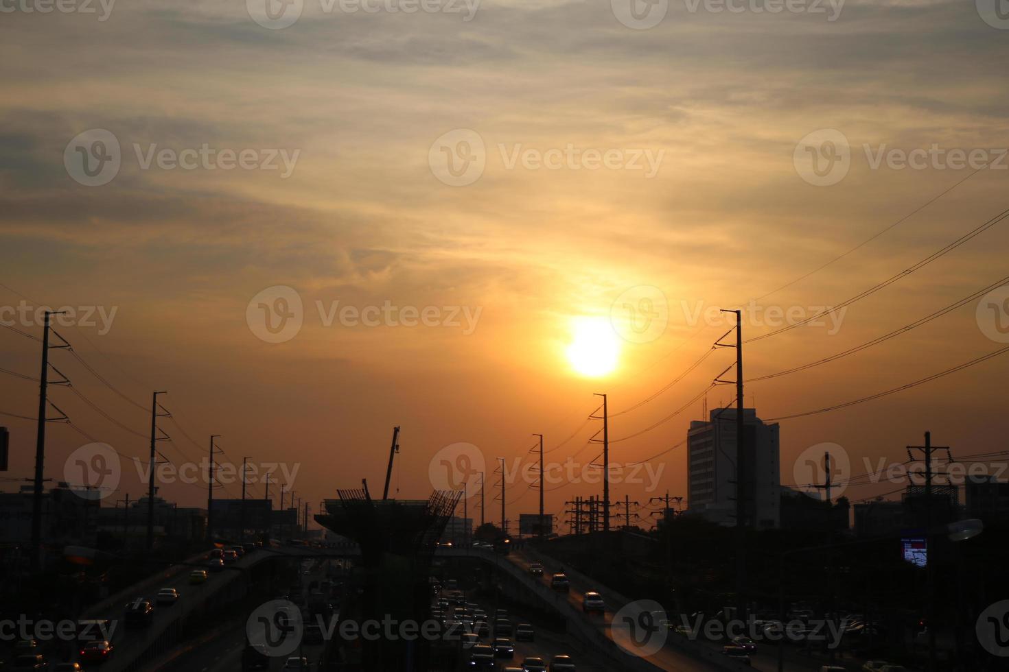 dark storm cloudy sky in rainy day on sunset time with city building background photo