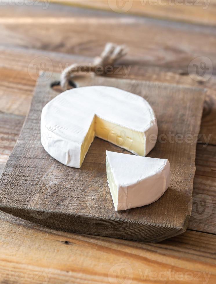 Camembert cheese on the wooden board photo