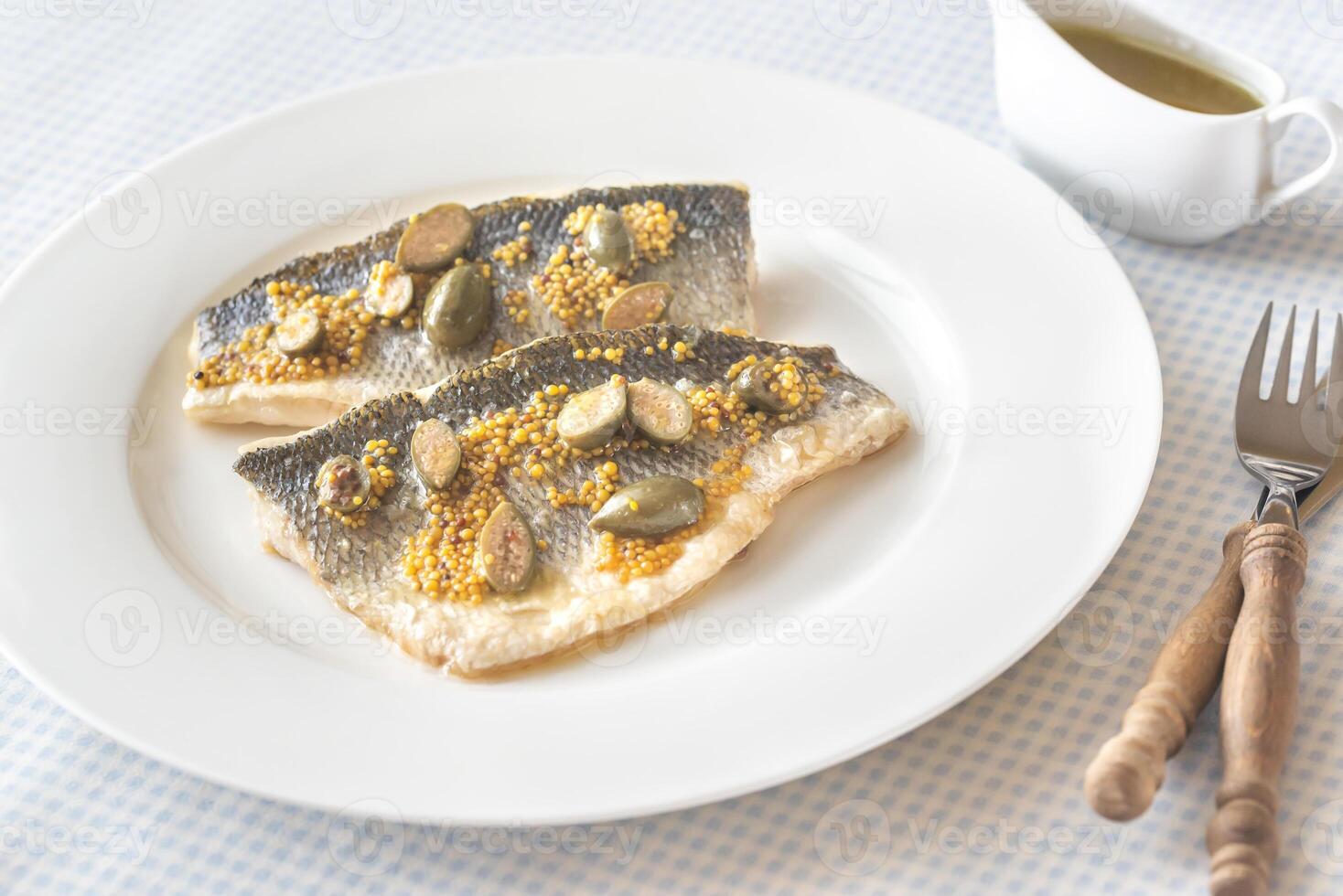 Baked sea bass with capers 17683865 Stock Photo at Vecteezy