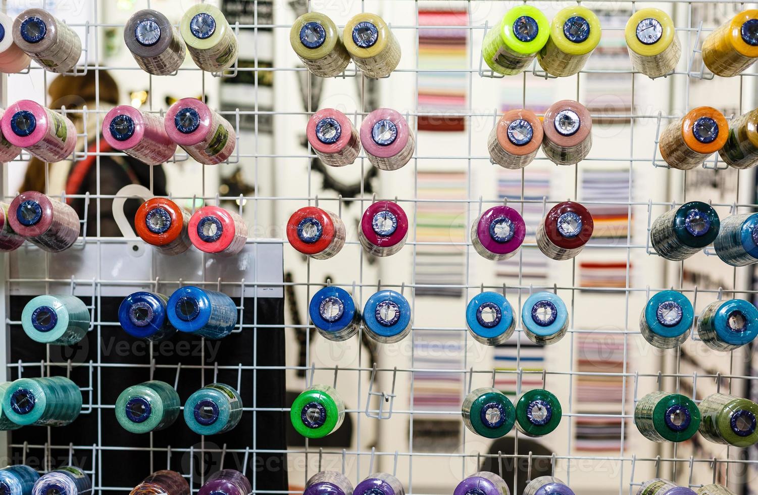 Bobbins with colored thread for industrial textile machines photo