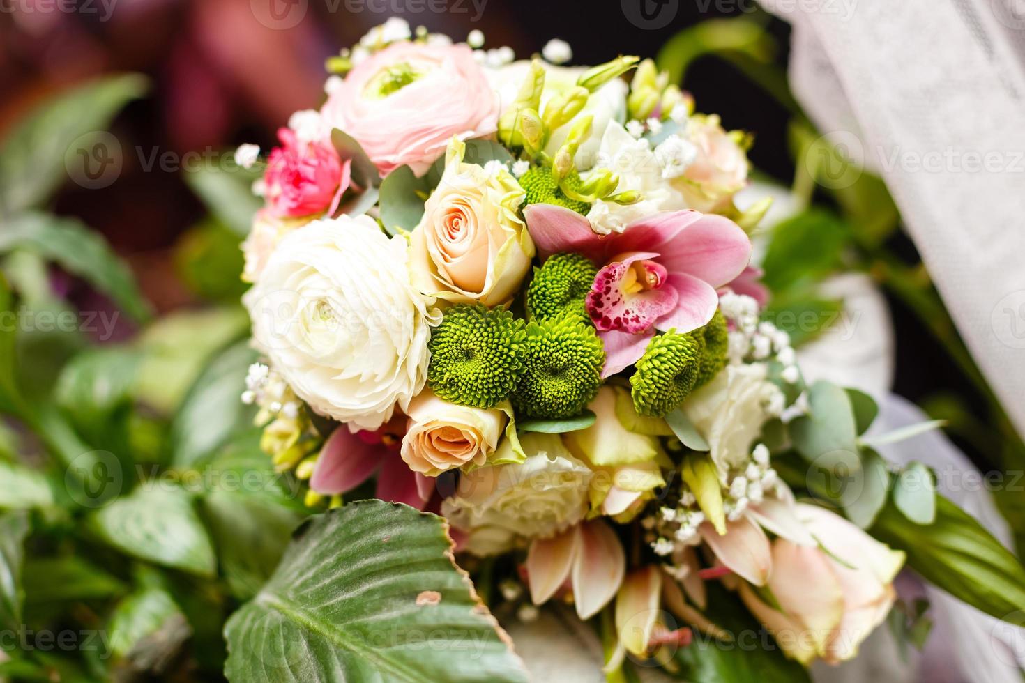 elegant wedding bouquet on table at restaurant photo