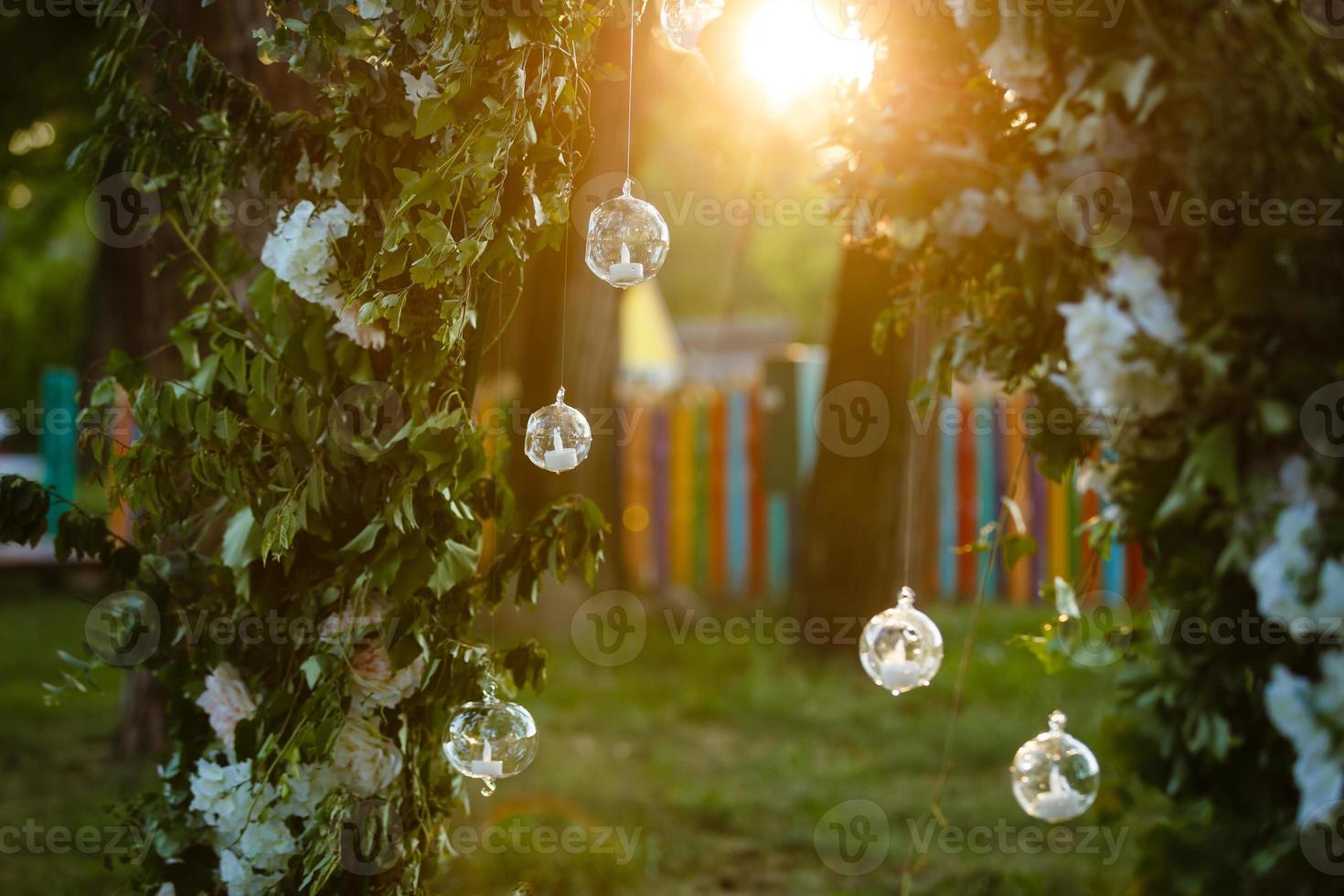 Original wedding floral decoration in the form of mini-vases and bouquets of flowers hanging from the ceiling photo