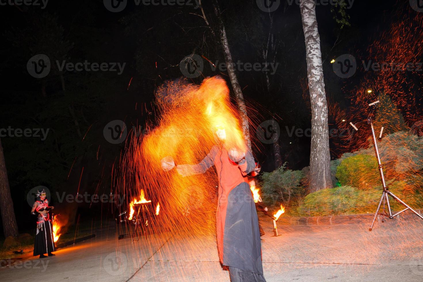 fire show and a lot of the bright sparks in the night photo