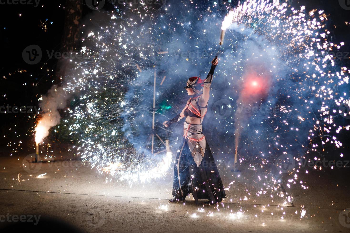 fire show and a lot of the bright sparks in the night photo