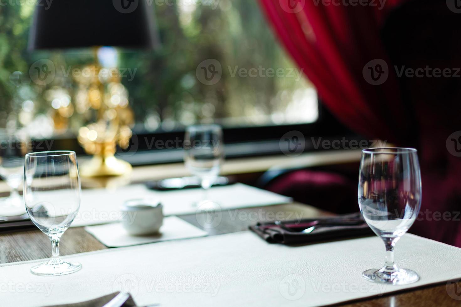 Glasses wine on table in sushi restaurant Serving in the restaurant on the table photo