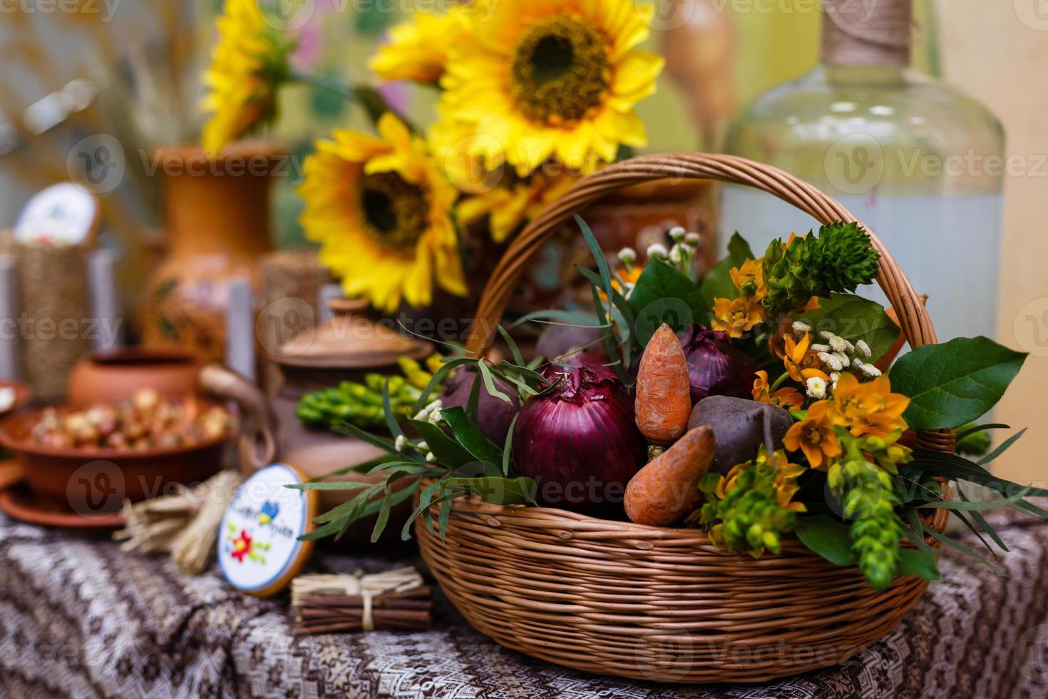 Basket with organic vegetables on the green grass and flowers. Outdoors. freshly harvested vegetables. raw vegetables in wicker basket.basket with Vegetables and Flowers photo