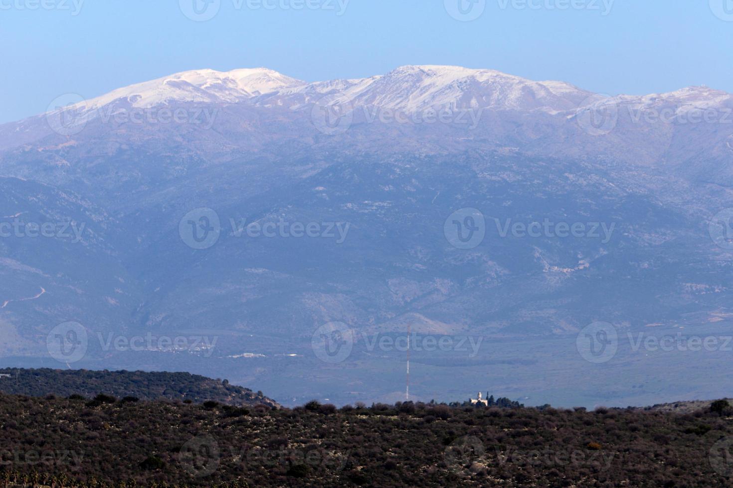 Snow lies on the top of Mount Hermon photo