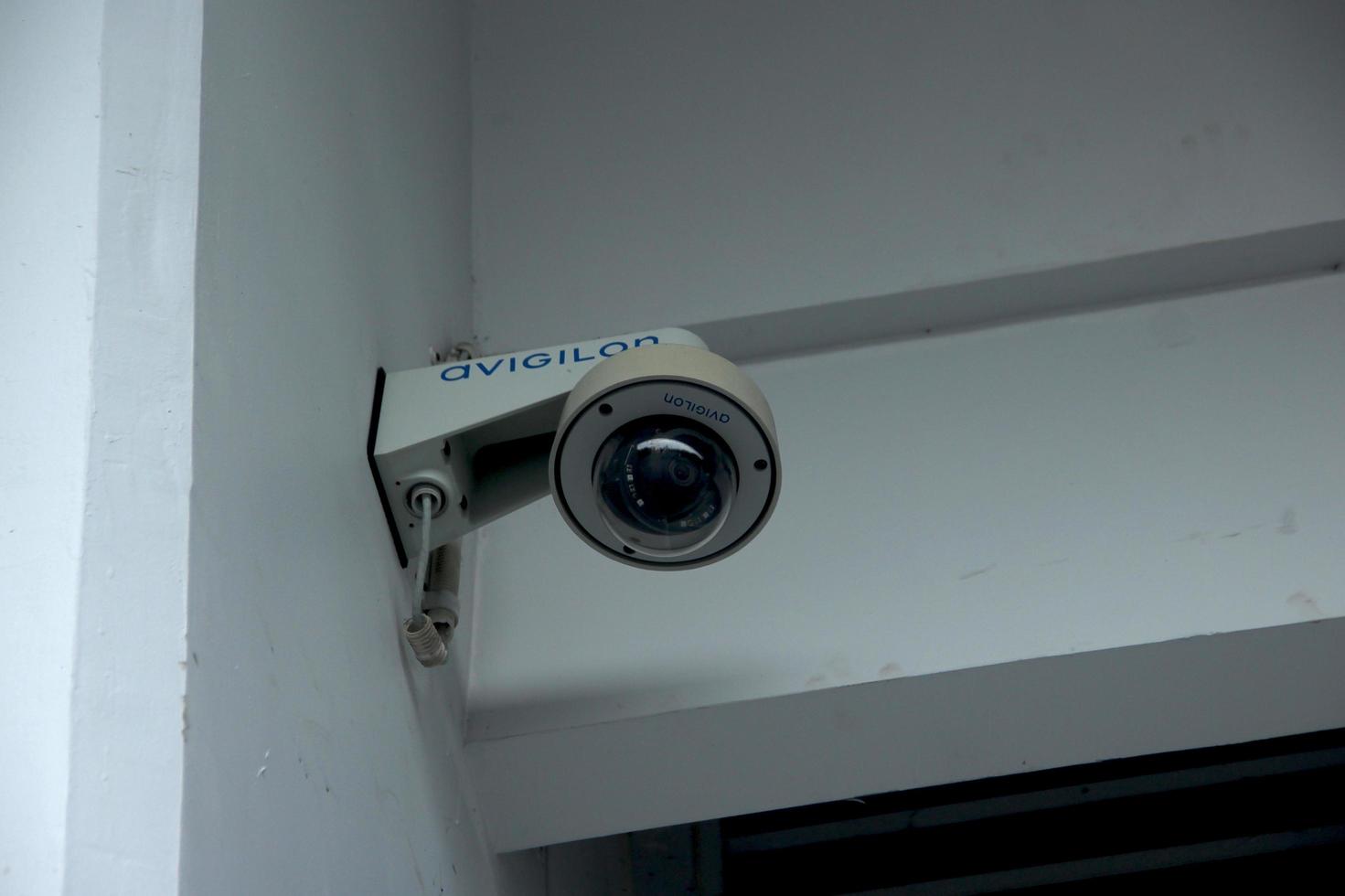 Jakarta, Indonesia - January 21th, 2023 - Avigilon security camera isolated on white walls. photo