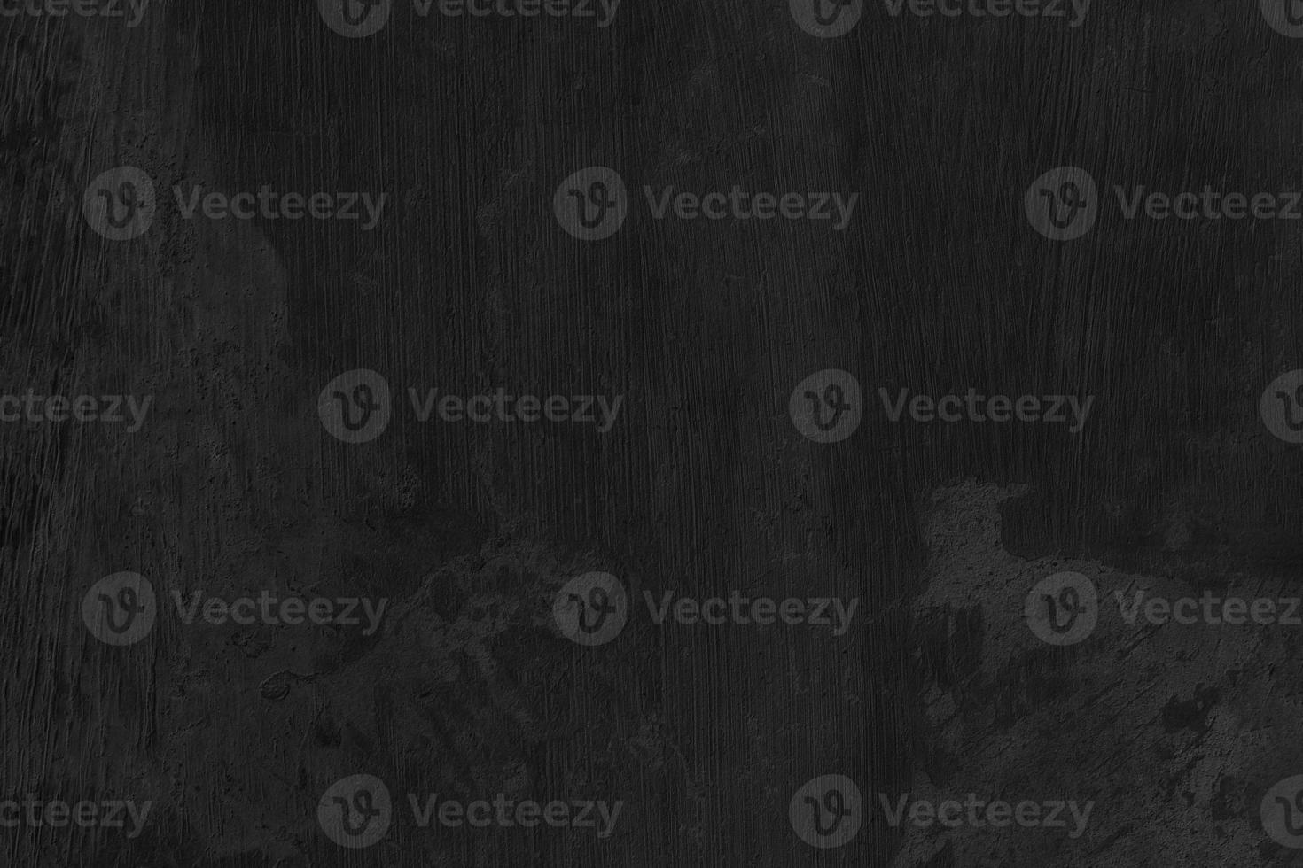 Black Cement scratch background. Texture placed over an object to create a grunge effect for your design. photo
